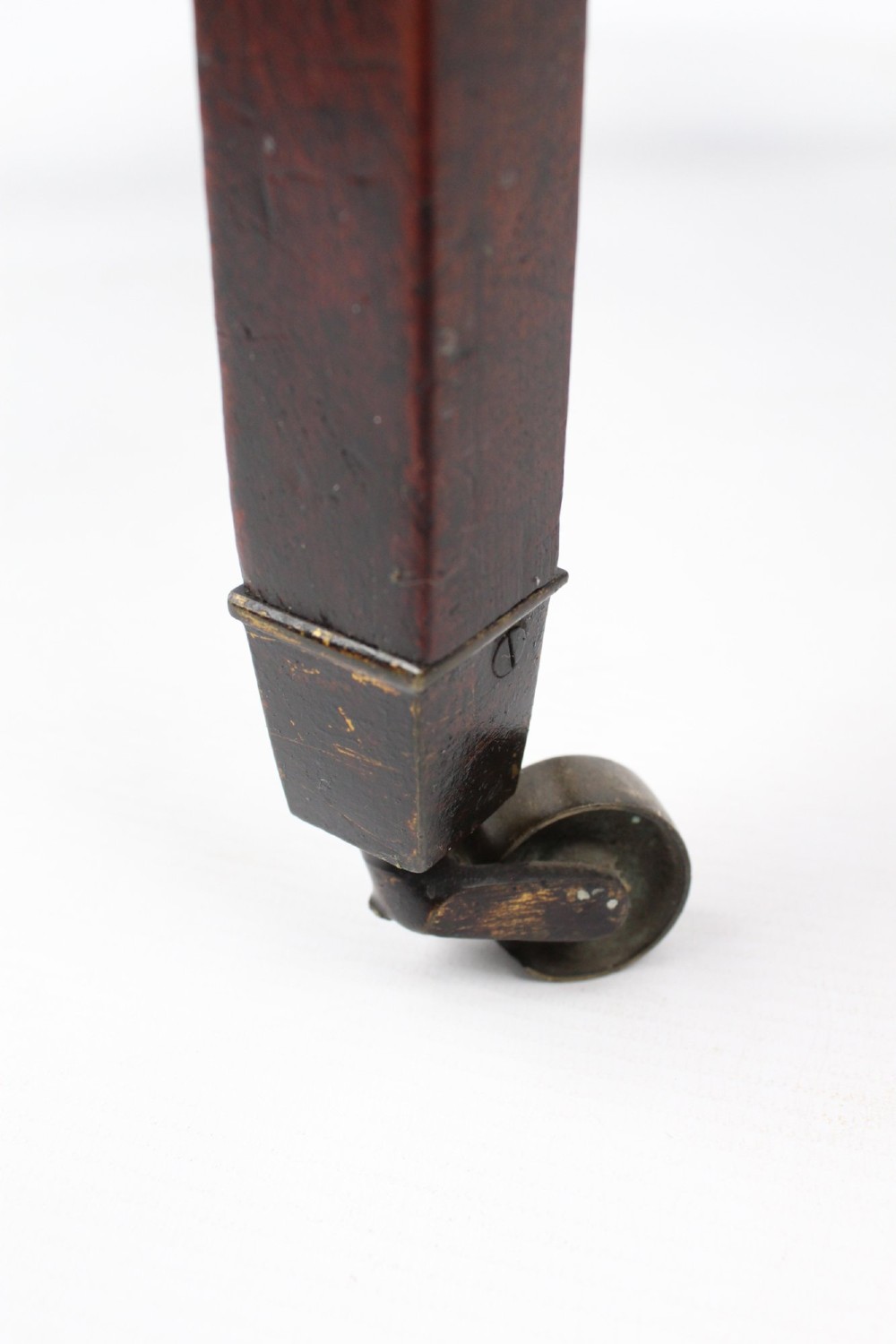 A small Georgian mahogany side table featuring a single drawer with brass ring handles, square tapered legs joined by an X-form stretcher, and brass castors. View XII