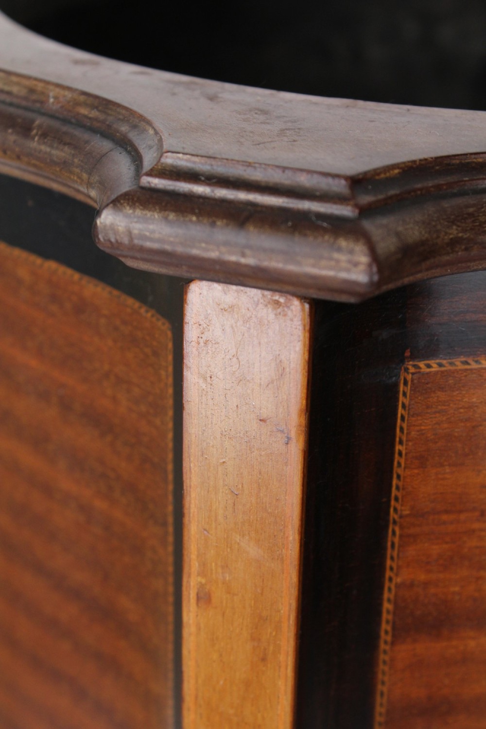 A tall Edwardian mahogany plant stand featuring shaped inlaid panels, four slender splayed legs, a lower shelf, and a dark metal liner. View X