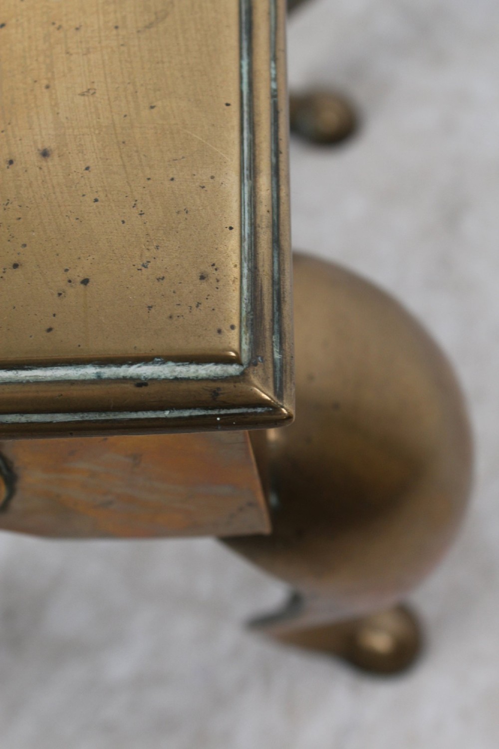 An antique Georgian brass footman featuring cabriole front legs, turned rear legs, side drop handles, and a rectangular top surface. View VII