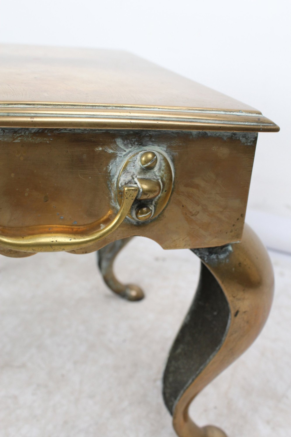 An antique Georgian brass footman featuring cabriole front legs, turned rear legs, side drop handles, and a rectangular top surface. View IX