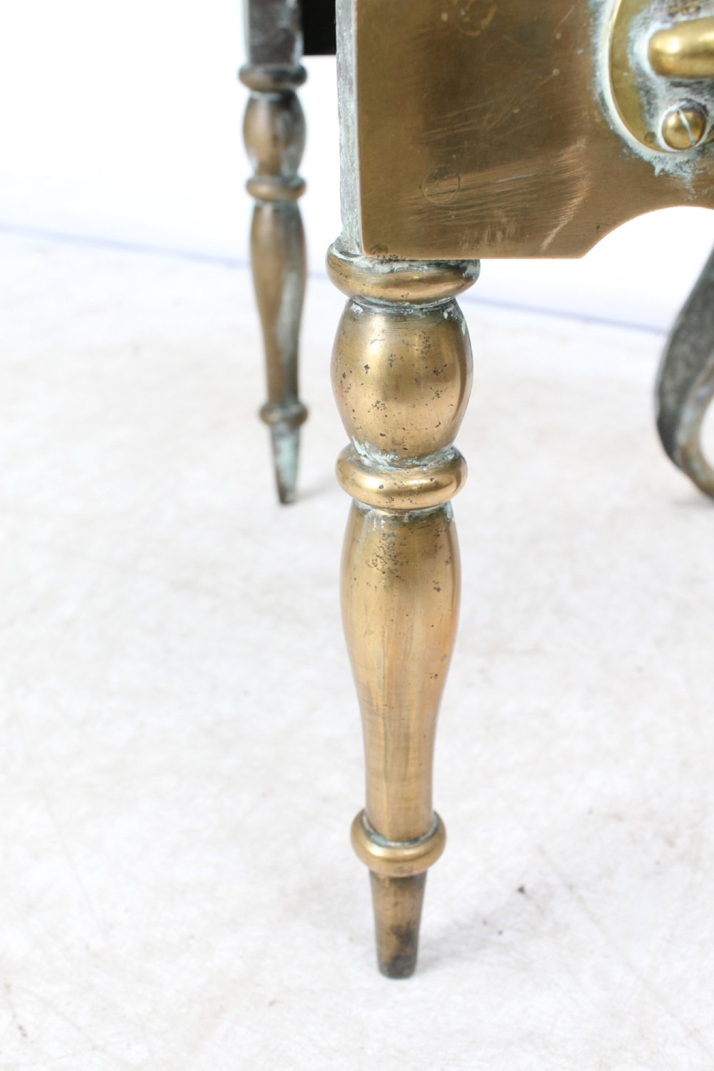 An antique Georgian brass footman featuring cabriole front legs, turned rear legs, side drop handles, and a rectangular top surface. View XI