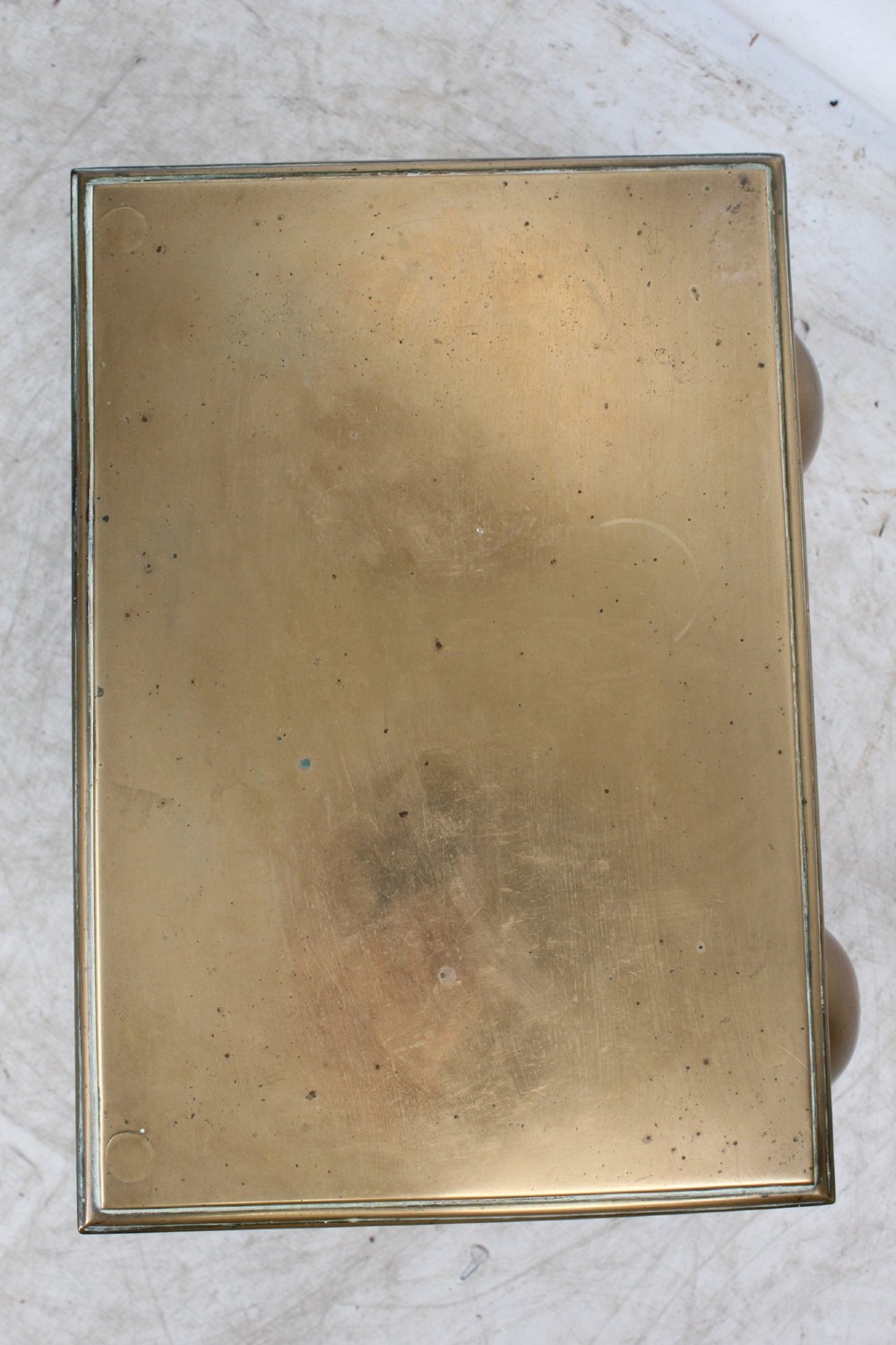 An antique Georgian brass footman featuring cabriole front legs, turned rear legs, side drop handles, and a rectangular top surface. View XII