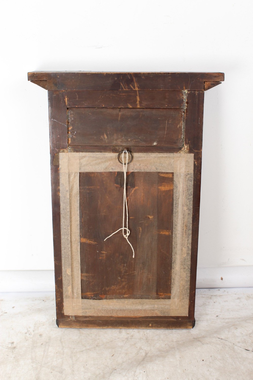 A small rectangular Regency mahogany pier mirror featuring an overhanging upper cornice, side column supports, and foxed glass. View XIII