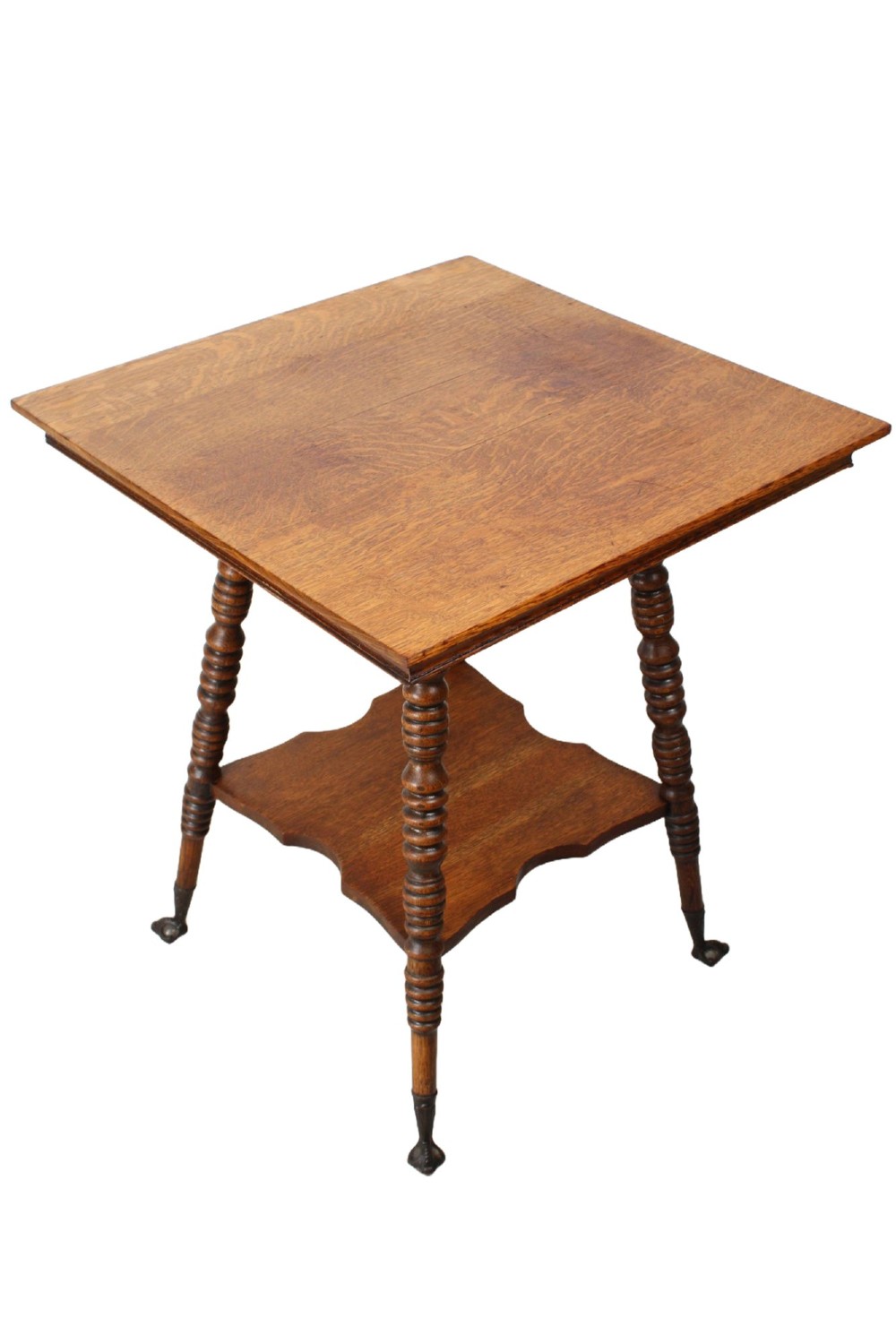 An antique warm brown oak side table featuring bobbin-turned legs, a lower rectangular shelf, and claw feet. View II