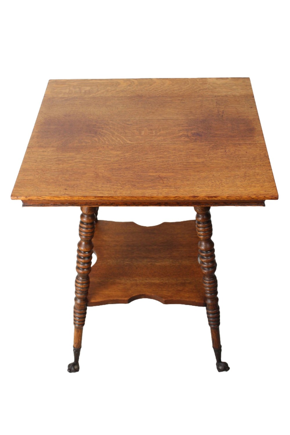An antique warm brown oak side table featuring bobbin-turned legs, a lower rectangular shelf, and claw feet. View III