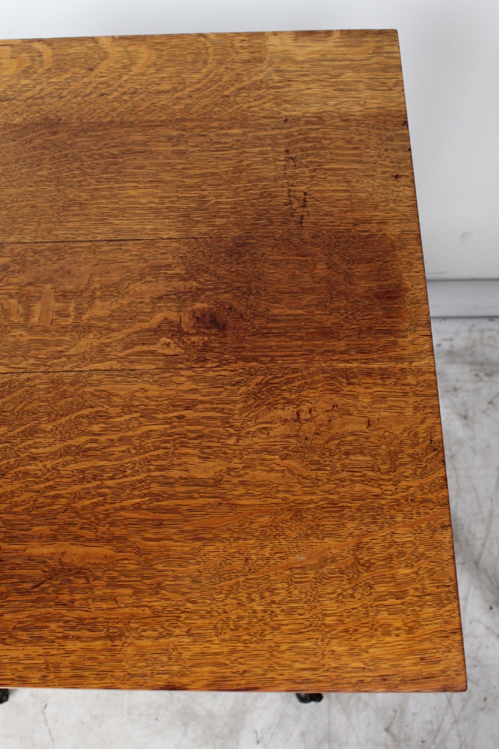 An antique warm brown oak side table featuring bobbin-turned legs, a lower rectangular shelf, and claw feet. View IV