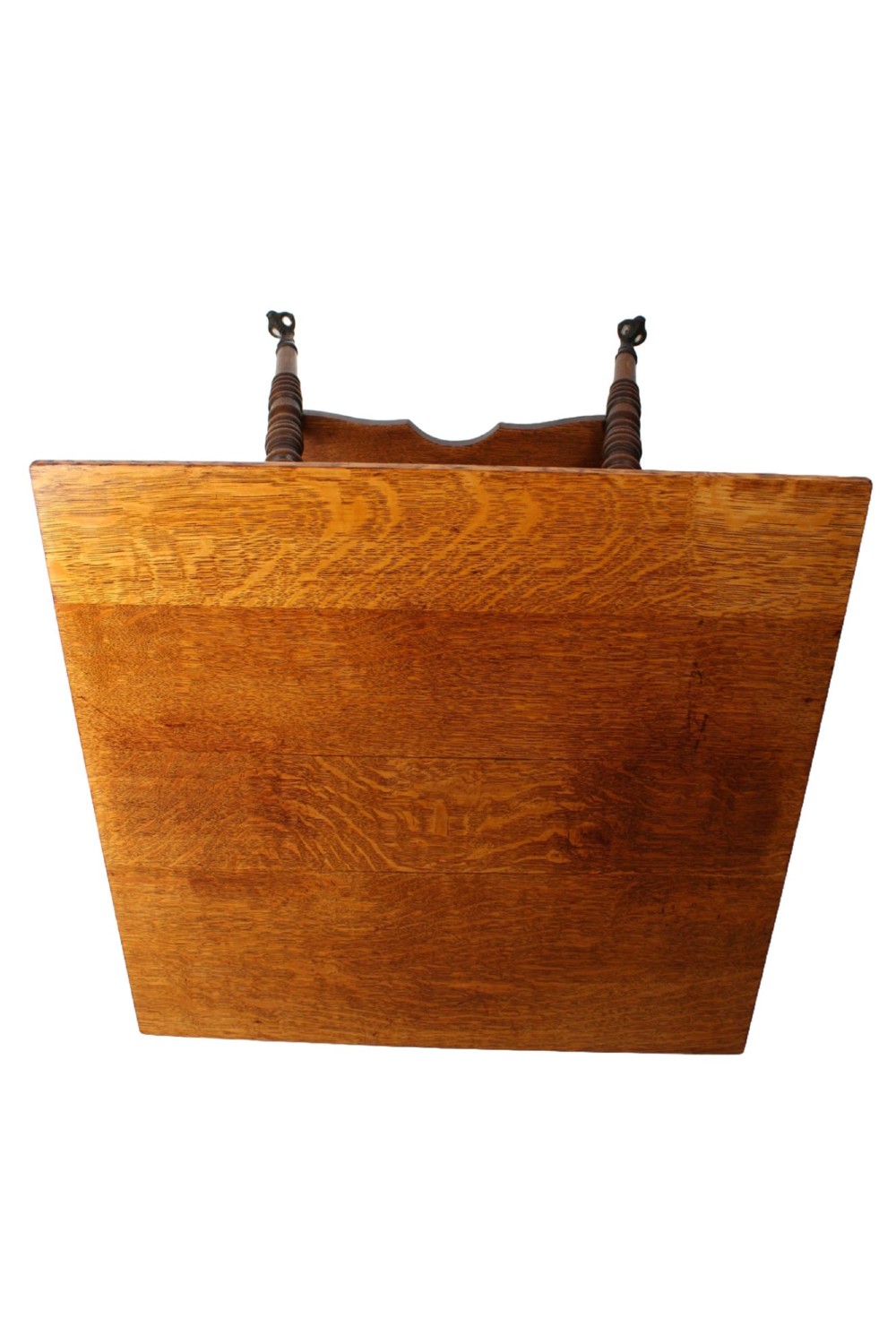 An antique warm brown oak side table featuring bobbin-turned legs, a lower rectangular shelf, and claw feet. View X