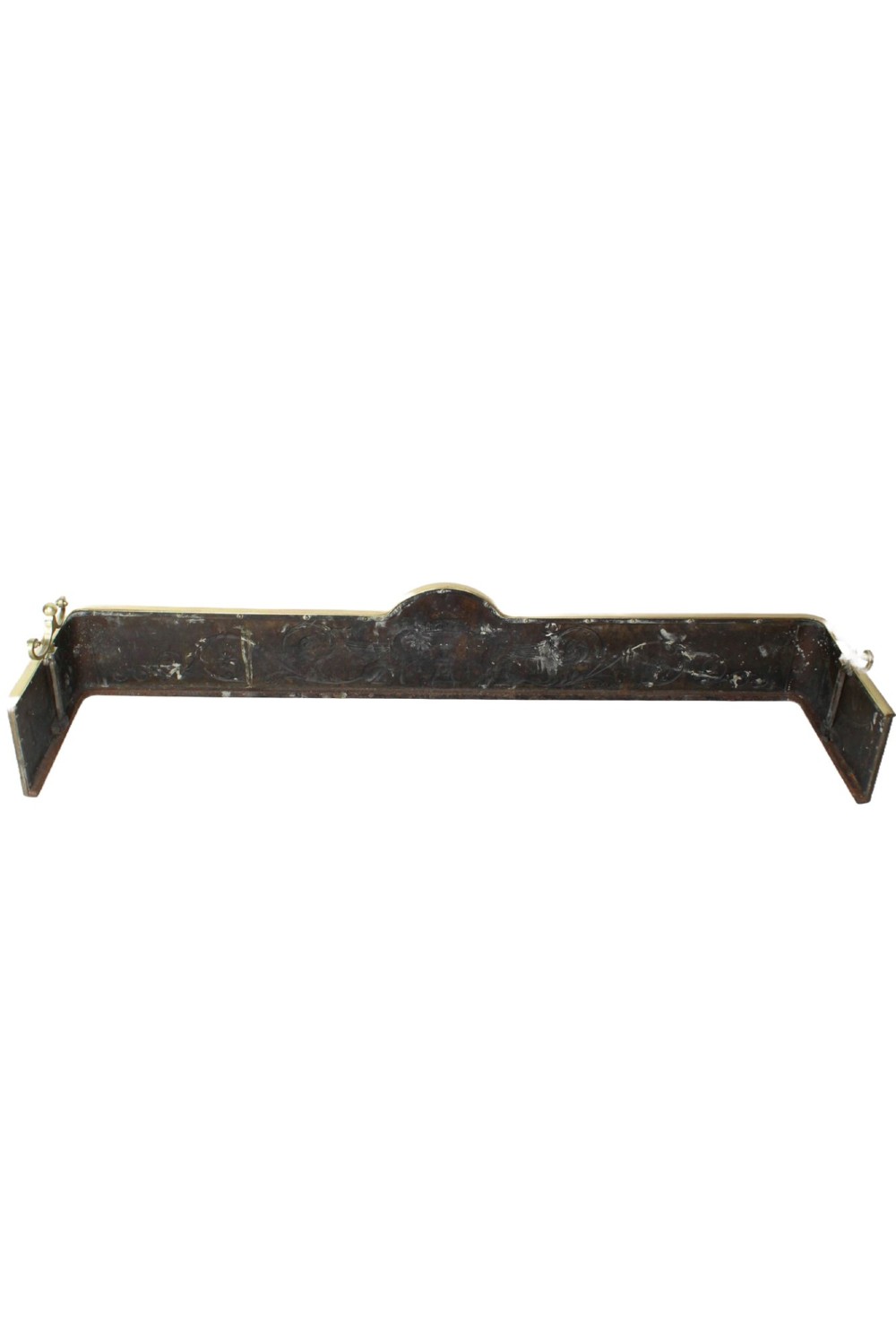 A long Victorian brass fireplace fender featuring embossed Neoclassical relief decoration of central urns, winged sphinxes, and foliate scrolls. View IV