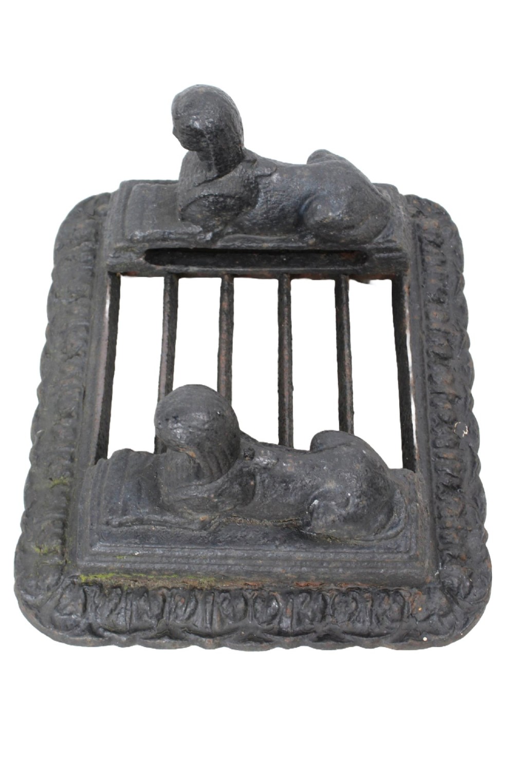 A dark cast iron boot scraper featuring twin sphinx figures flanking a central slatted grate set upon a decorative moulded base. View IV