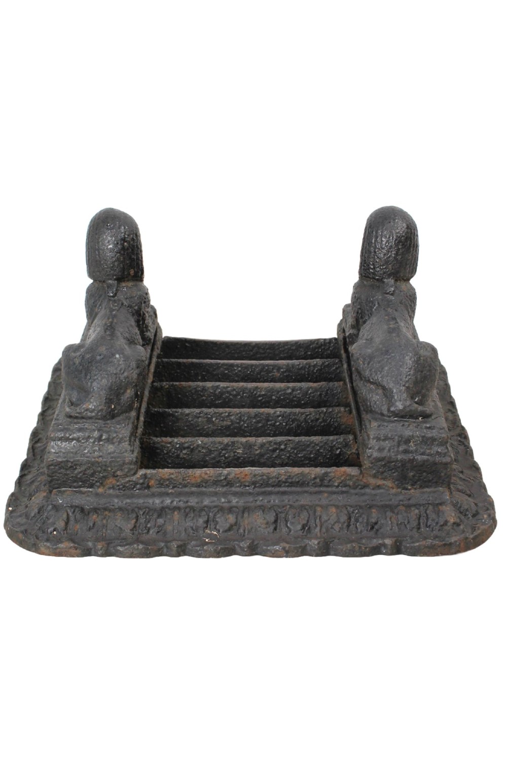 A dark cast iron boot scraper featuring twin sphinx figures flanking a central slatted grate set upon a decorative moulded base. View V