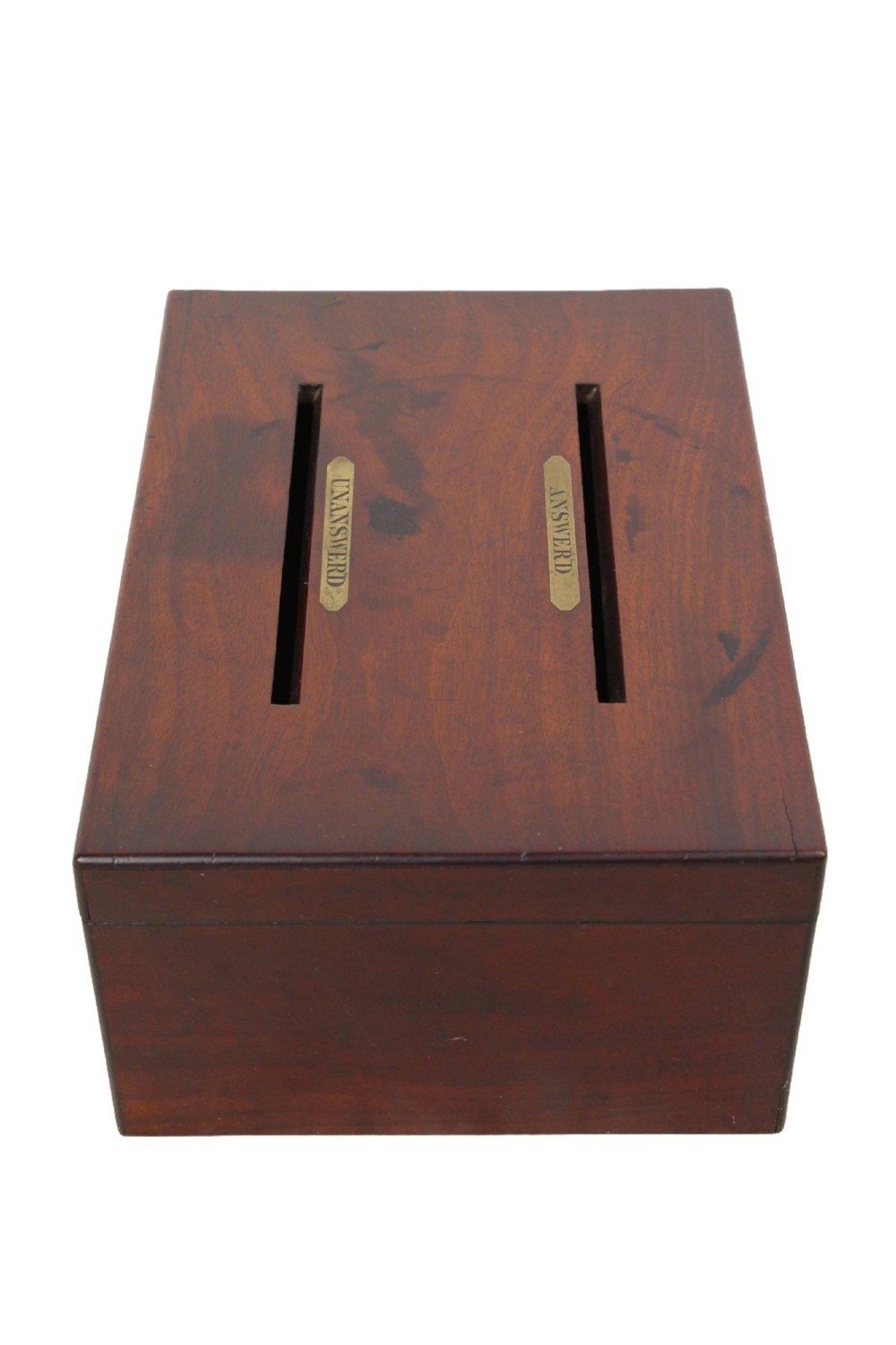 A Victorian mahogany letter box featuring two top slots labeled Answerd and Unanswerd with brass plaques and a circular keyhole escutcheon on the front. View V