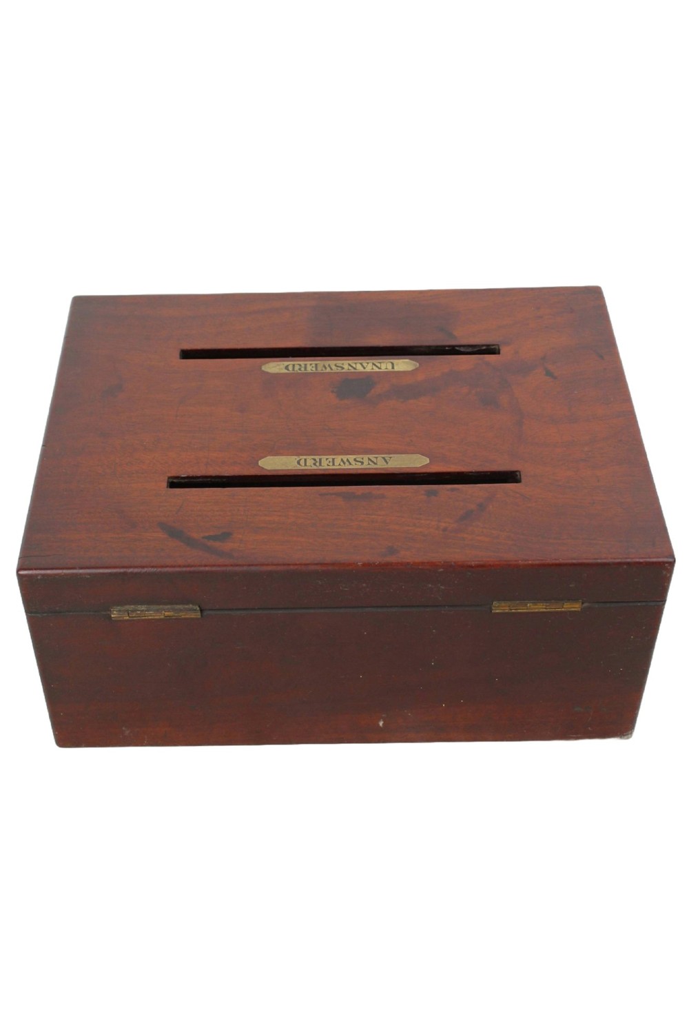 A Victorian mahogany letter box featuring two top slots labeled Answerd and Unanswerd with brass plaques and a circular keyhole escutcheon on the front. View VI