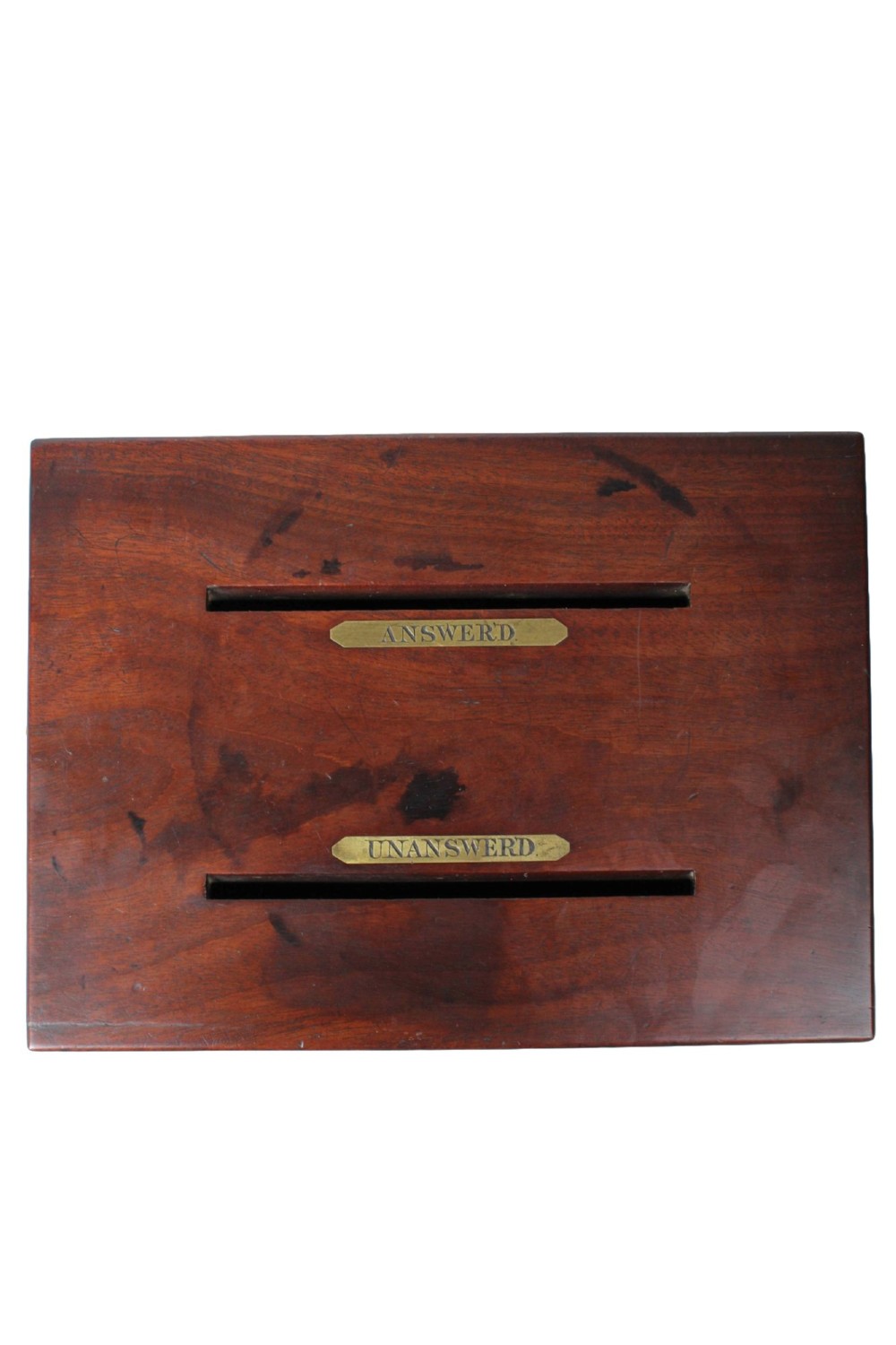A Victorian mahogany letter box featuring two top slots labeled Answerd and Unanswerd with brass plaques and a circular keyhole escutcheon on the front. View VII