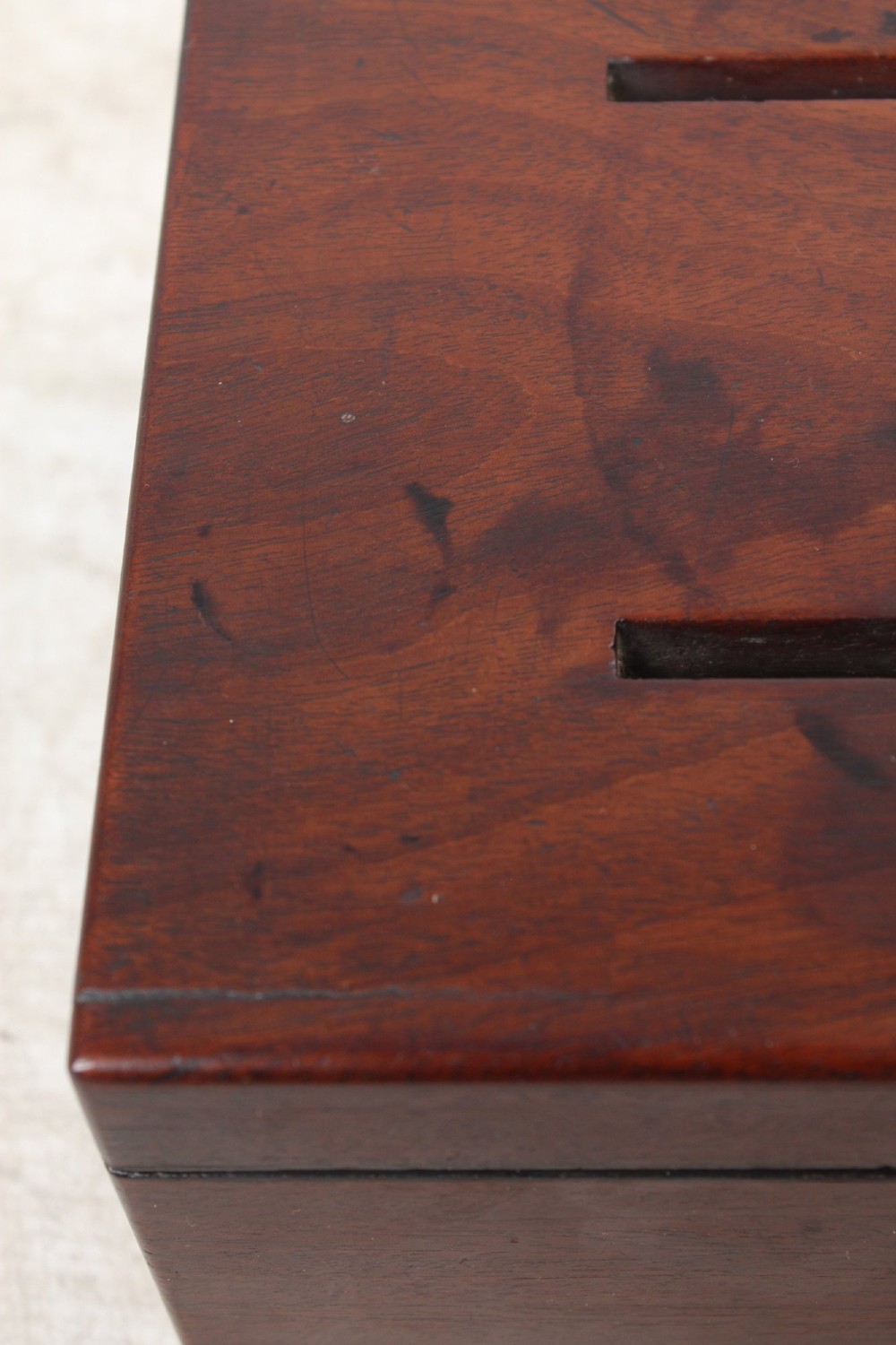 A Victorian mahogany letter box featuring two top slots labeled Answerd and Unanswerd with brass plaques and a circular keyhole escutcheon on the front. View IX