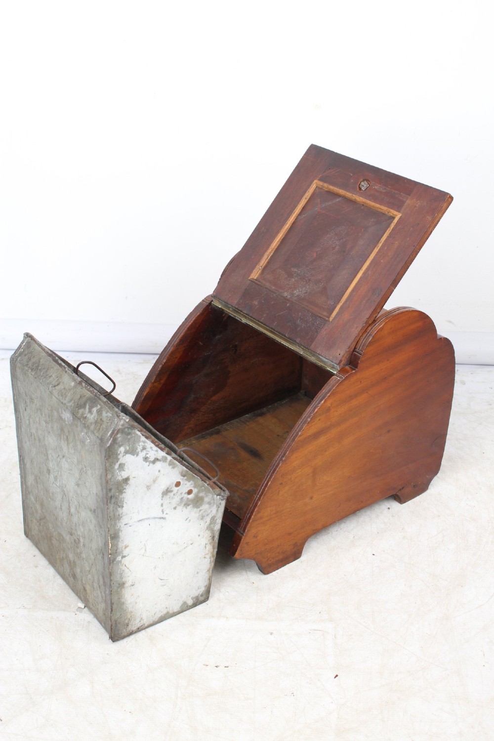 A Victorian mahogany coal scuttle featuring a slanted drop-front door with decorative timber inlay and a polished brass carrying handle on top. View III