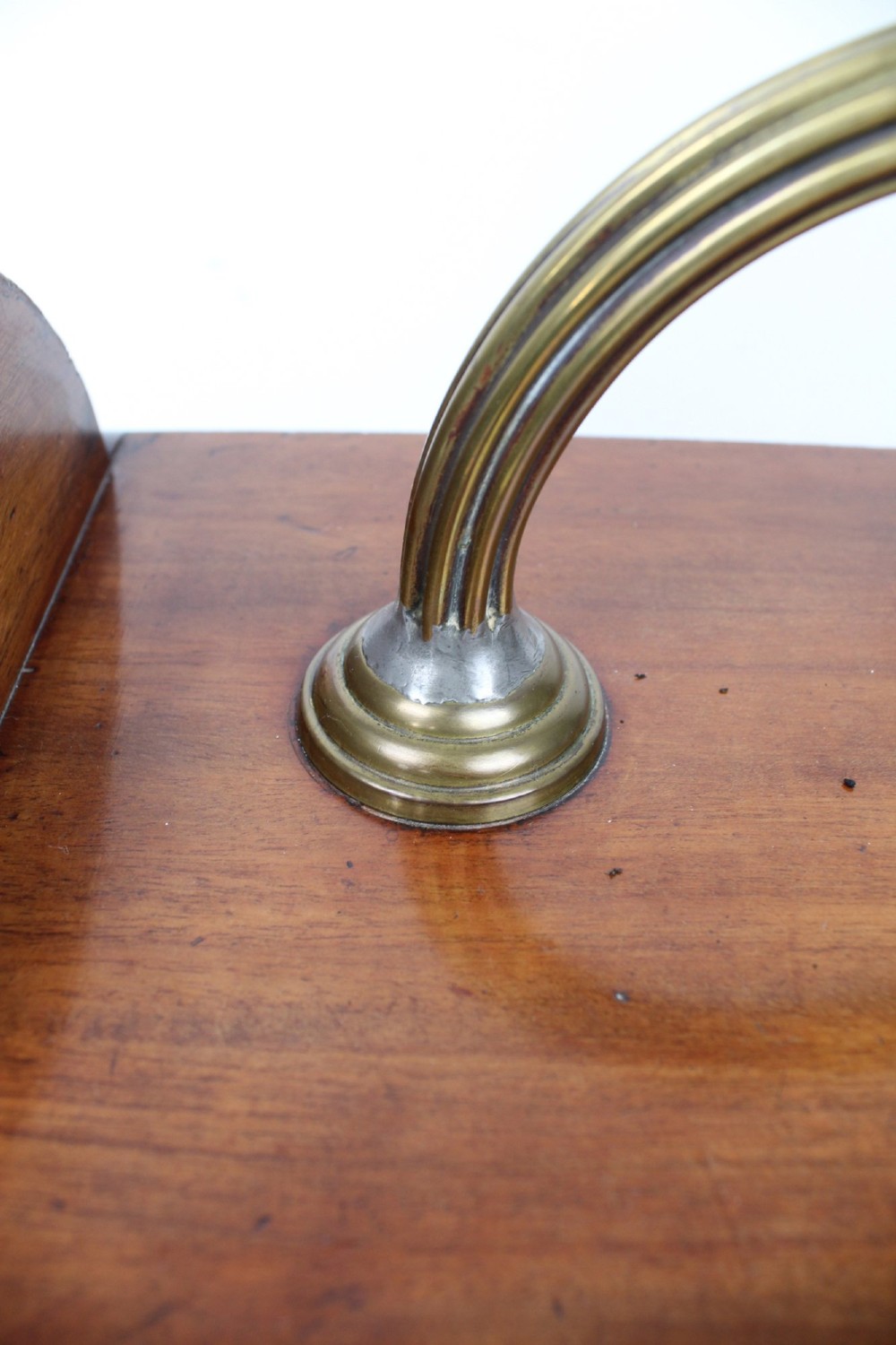A Victorian mahogany coal scuttle featuring a slanted drop-front door with decorative timber inlay and a polished brass carrying handle on top. View IX