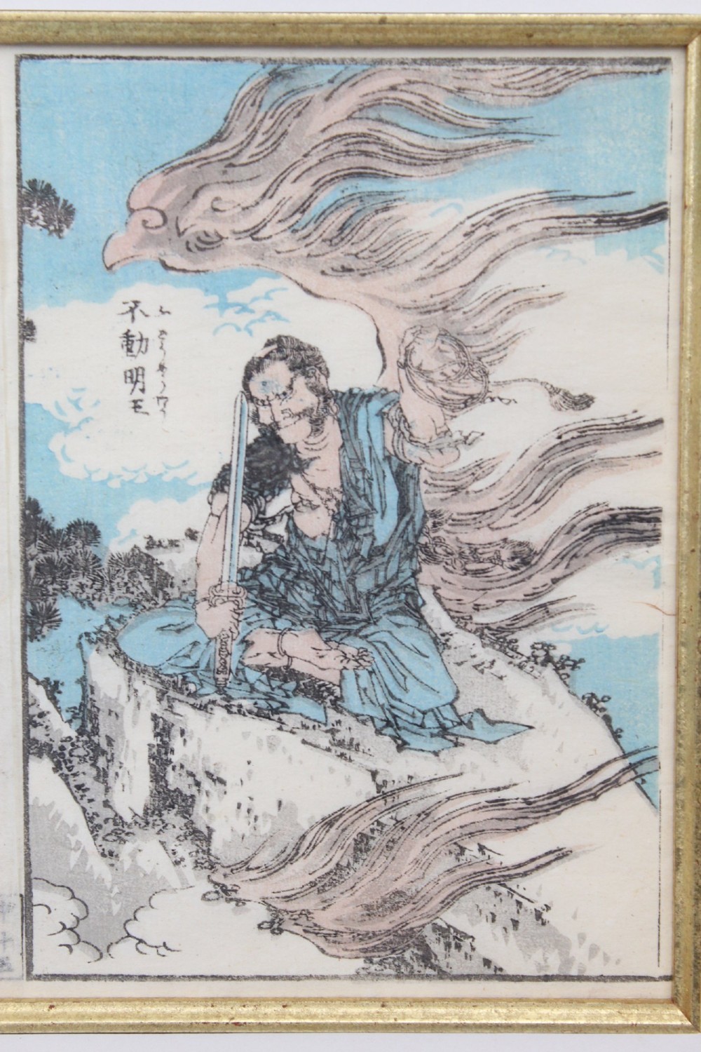 A pair of framed Japanese woodblock prints featuring detailed figurative and landscape illustrations mounted in cream mats within dark wooden frames. View IX