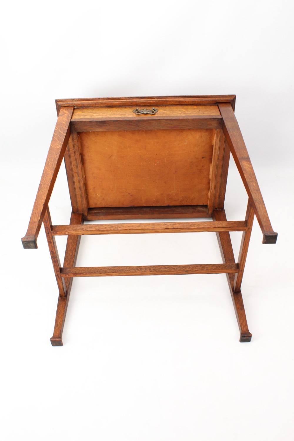 A compact Arts and Crafts oak writing desk featuring a single drawer with a brass drop handle, straight square legs, and lower stretchers. View XIII