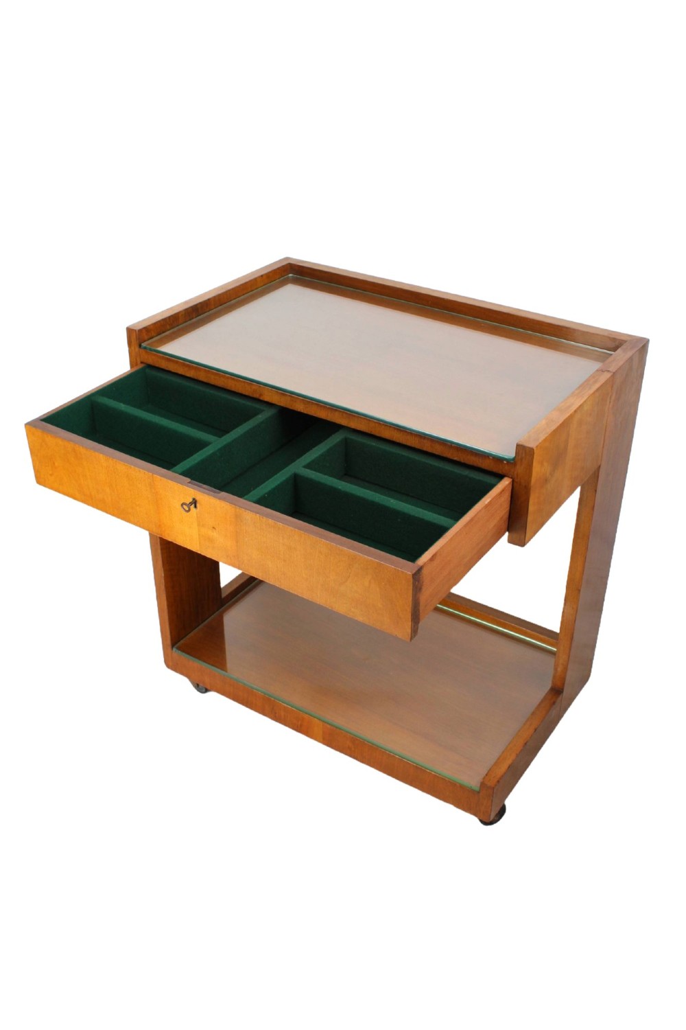 An Art Deco warm brown walnut two-tier trolley featuring inset glass tops, a drawer with a brass keyhole, and concealed castors. View IV