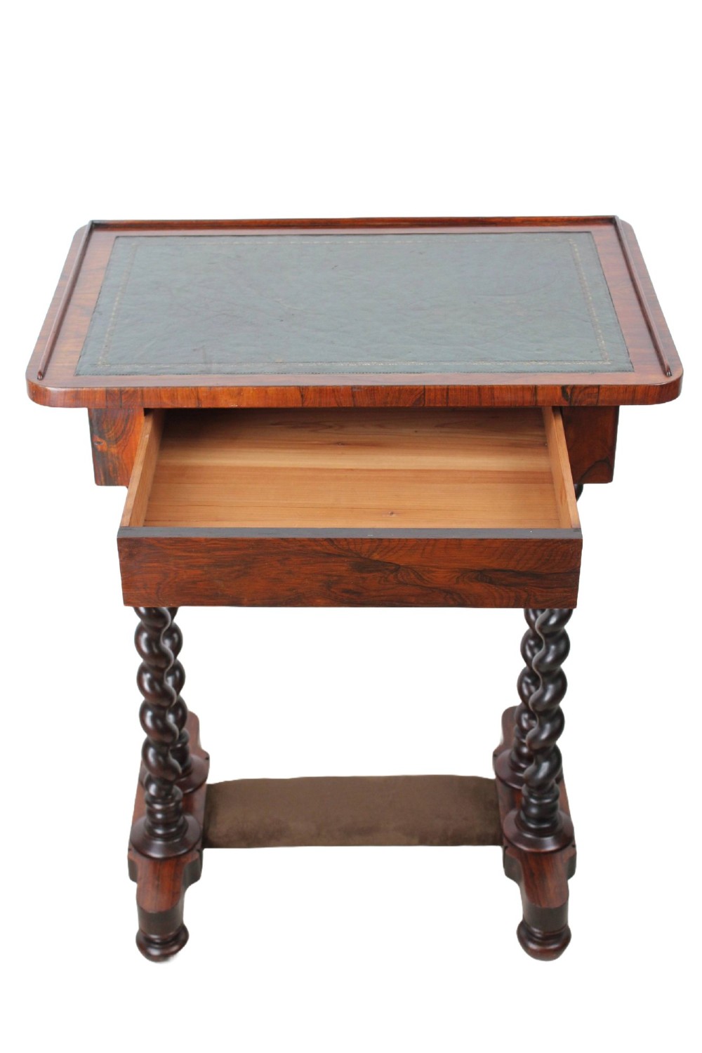 A small Regency rosewood side table featuring an inset green leather top with gold leaf tooling, supported by twin barley twist columns on a trestle base. View II