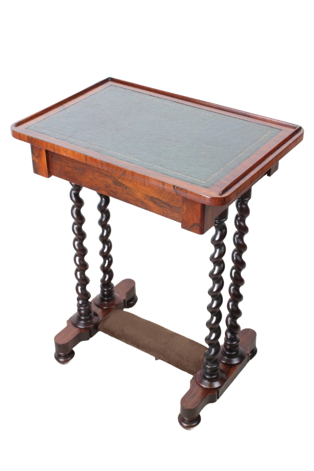 A small Regency rosewood side table featuring an inset green leather top with gold leaf tooling, supported by twin barley twist columns on a trestle base. View III