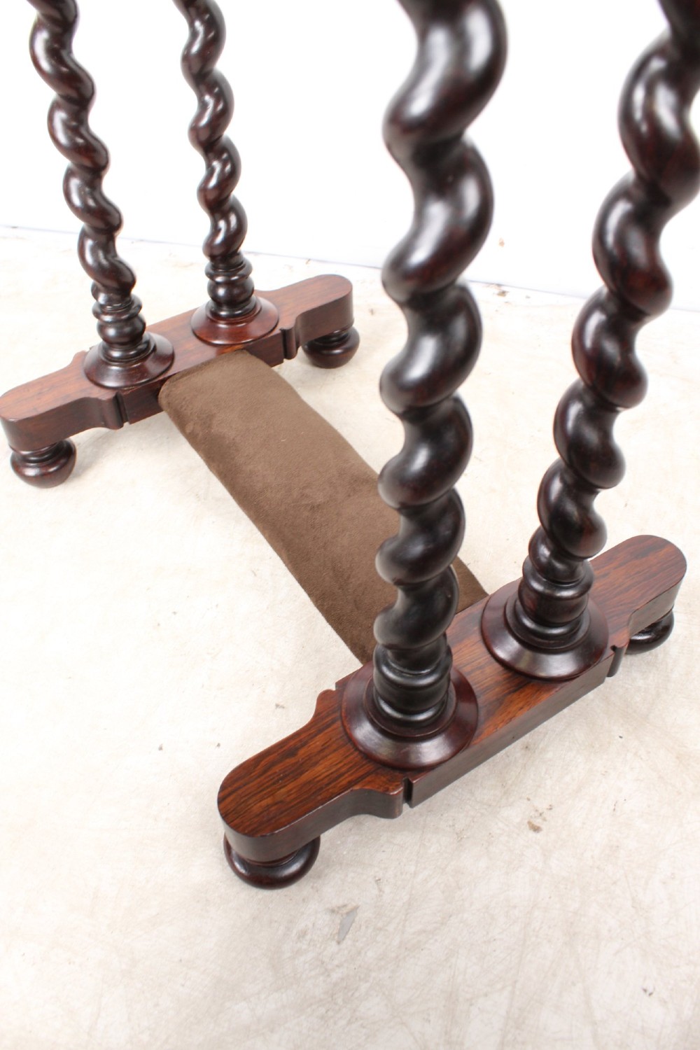 A small Regency rosewood side table featuring an inset green leather top with gold leaf tooling, supported by twin barley twist columns on a trestle base. View VIII