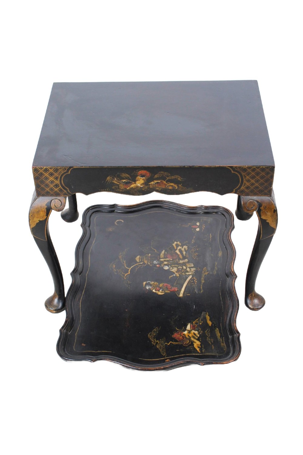 A low black lacquered Edwardian coffee table featuring gilded Chinoiserie figures, a serpentine tray-top edge, and cabriole legs. View II