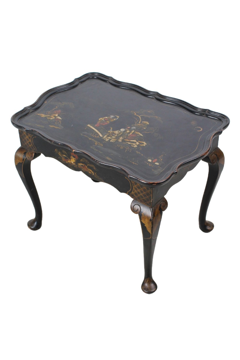 A low black lacquered Edwardian coffee table featuring gilded Chinoiserie figures, a serpentine tray-top edge, and cabriole legs. View III