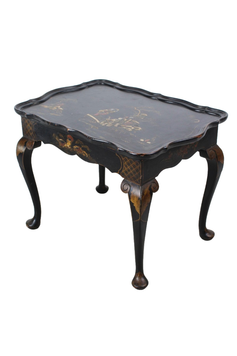 A low black lacquered Edwardian coffee table featuring gilded Chinoiserie figures, a serpentine tray-top edge, and cabriole legs. View IV