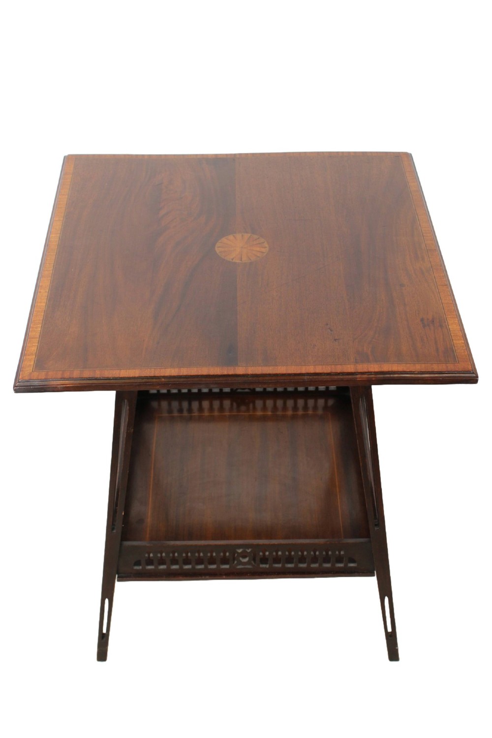 An Edwardian mahogany square side table featuring a central inlaid sunburst medallion, crossbanded border, and a lower undertier shelf with a pierced gallery.
