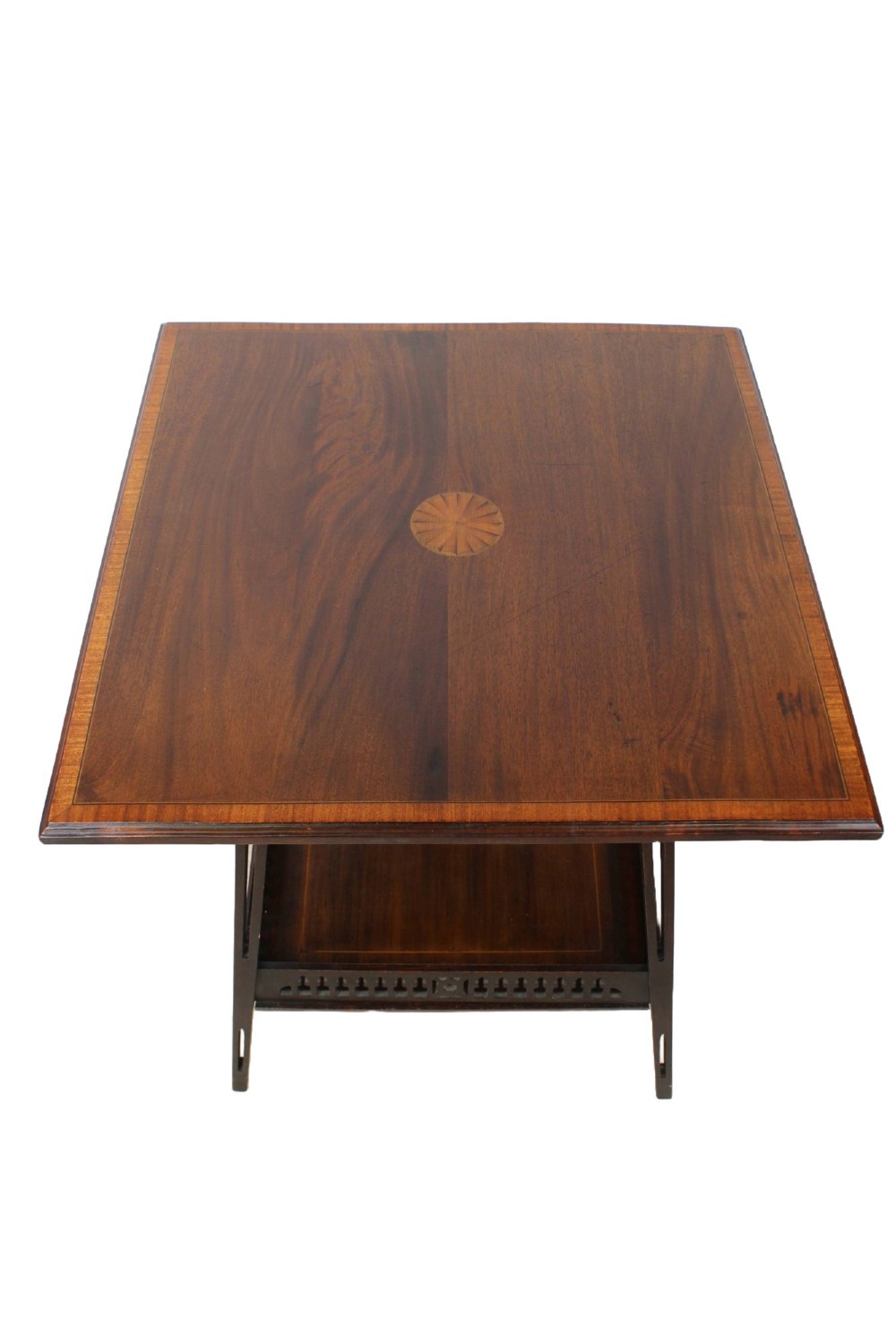 An Edwardian mahogany square side table featuring a central inlaid sunburst medallion, crossbanded border, and a lower undertier shelf with a pierced gallery. View II
