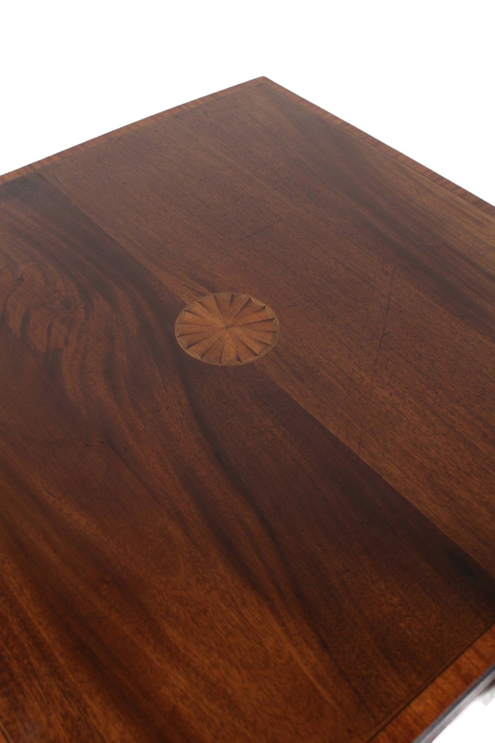 An Edwardian mahogany square side table featuring a central inlaid sunburst medallion, crossbanded border, and a lower undertier shelf with a pierced gallery. View IV
