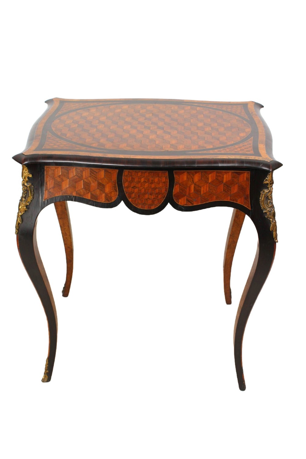 A Victorian Louis XV Revival writing table featuring geometric cube parquetry inlay, serpentine edges, ebonised borders, cabriole legs, and gold-toned bronze mounts. View V