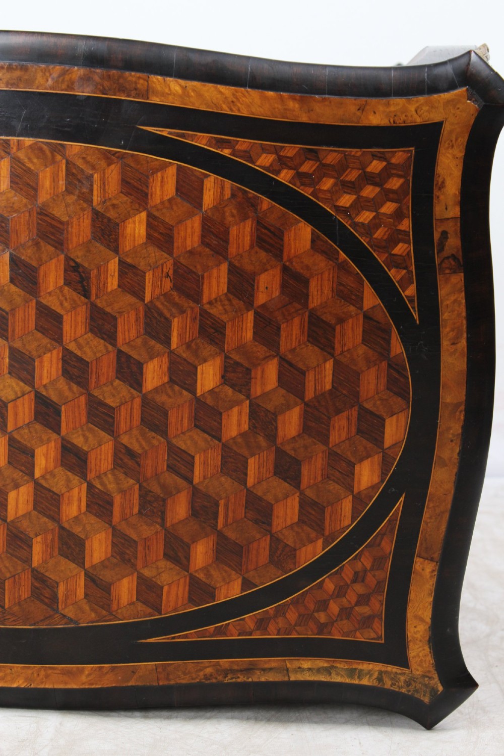 A Victorian Louis XV Revival writing table featuring geometric cube parquetry inlay, serpentine edges, ebonised borders, cabriole legs, and gold-toned bronze mounts. View XII