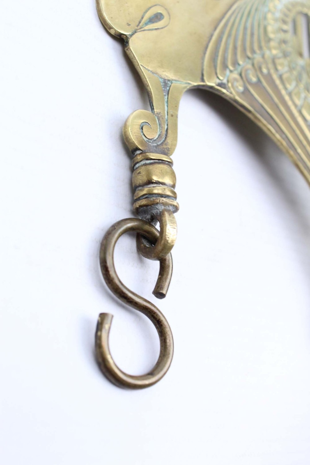 A stylized cast brass Art Deco wall hanging bracket featuring openwork scroll details and a lower swivel hook. View XIII