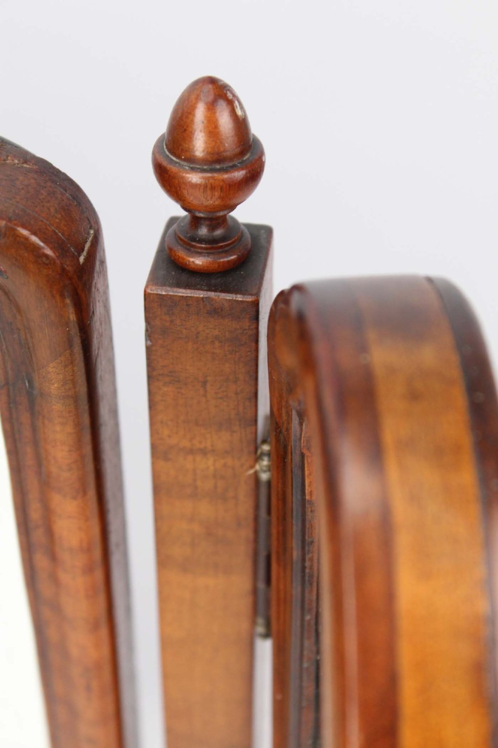 A three-panel walnut triptych dressing table mirror featuring arched side wings, turned finials, and brass hinges. View VIII