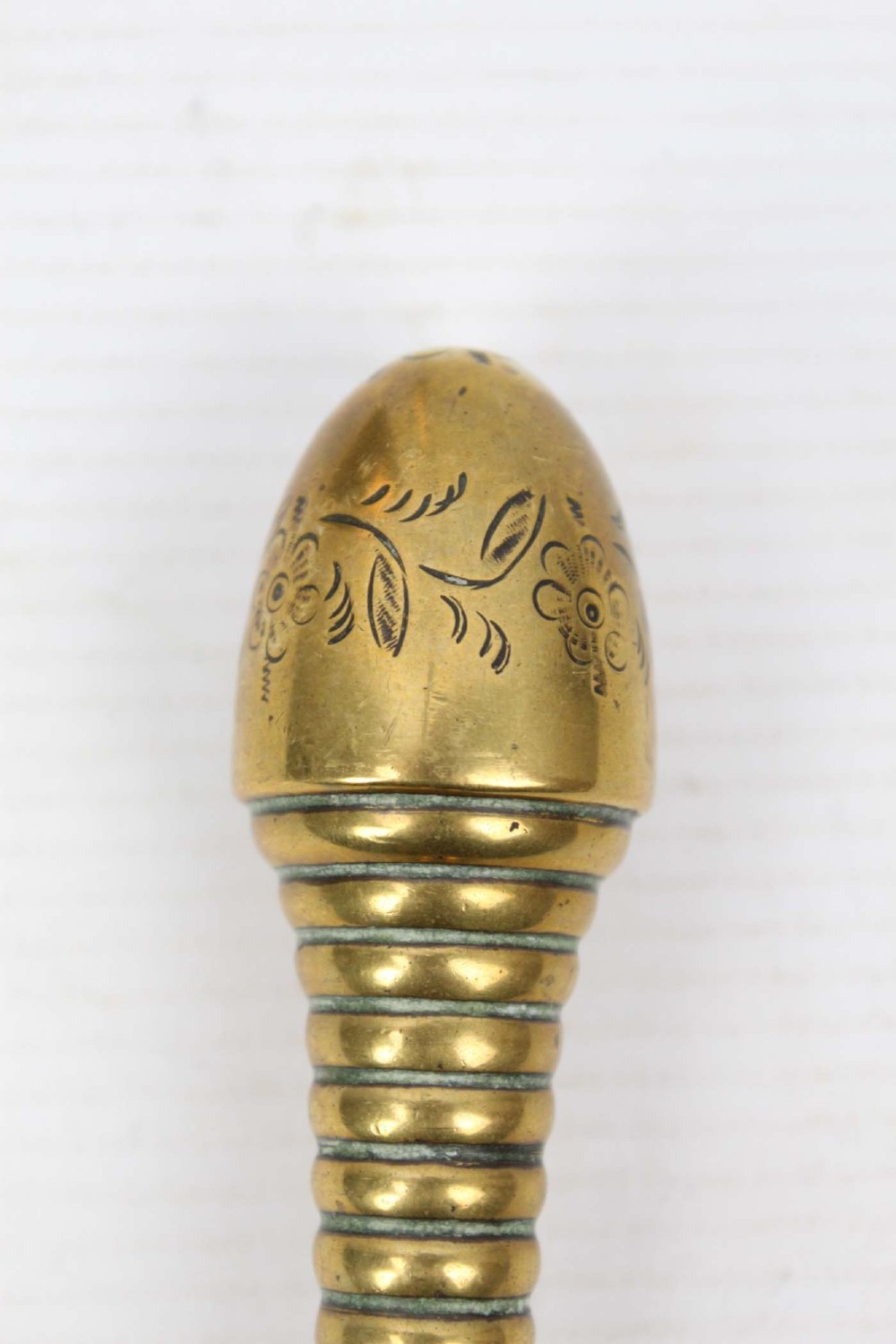 A three-piece set of Victorian brass fire tools consisting of a shovel, a poker, and tongs with turned and engraved handles. View V