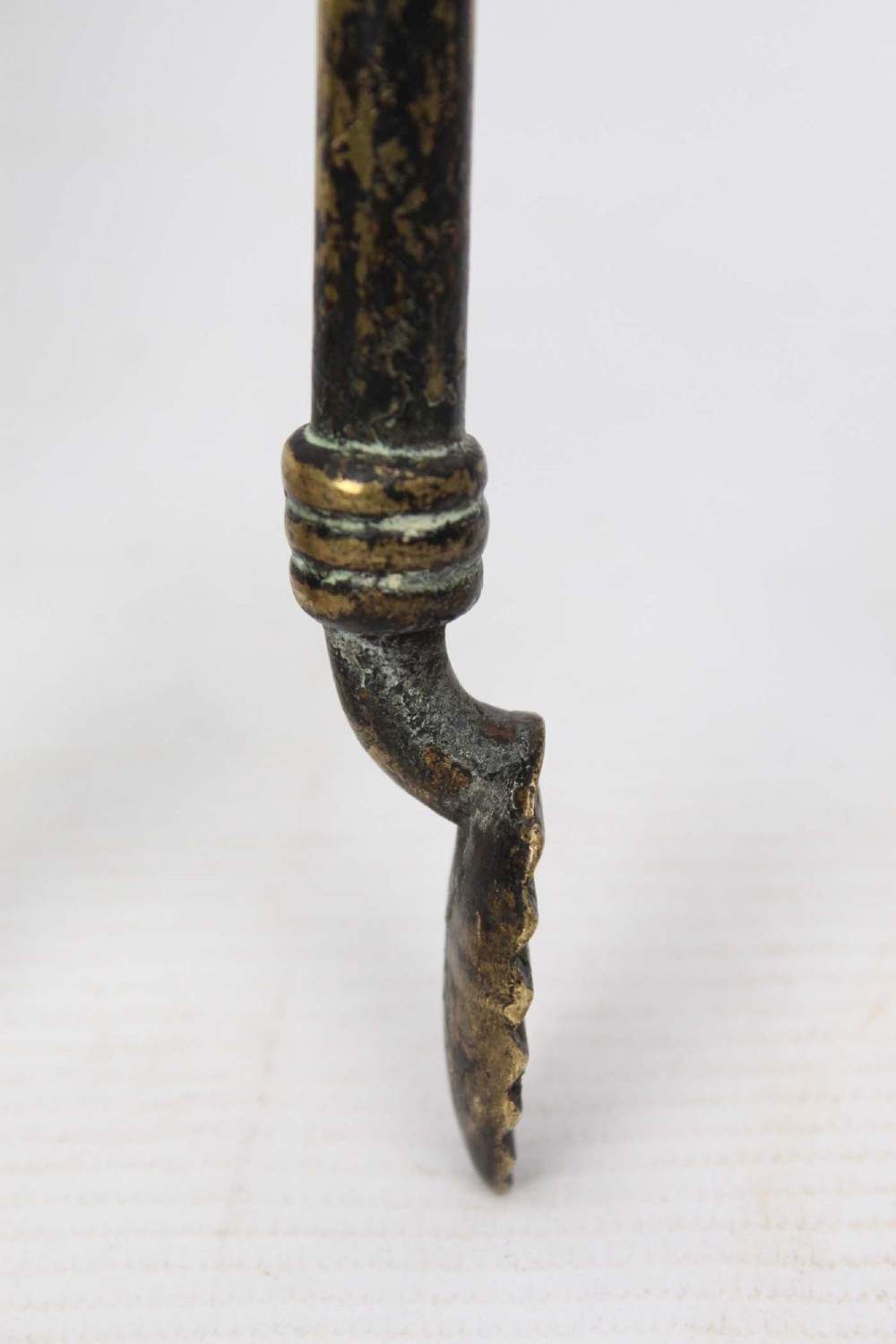 A three-piece set of Victorian brass fire tools consisting of a shovel, a poker, and tongs with turned and engraved handles. View XI
