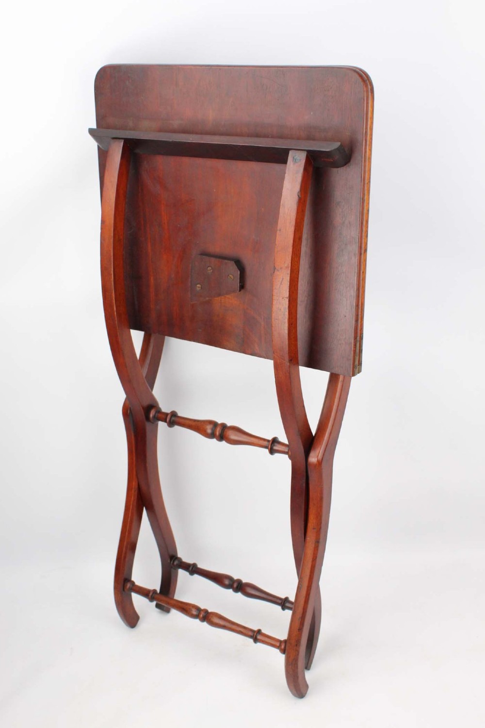 A Victorian mahogany coaching table featuring a rectangular folding top supported by curved X-frame legs and turned stretchers. View VI