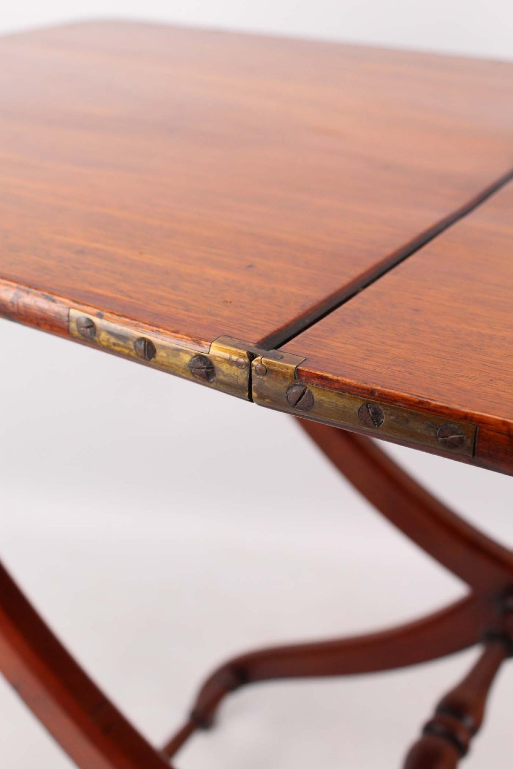 A Victorian mahogany coaching table featuring a rectangular folding top supported by curved X-frame legs and turned stretchers. View XIII