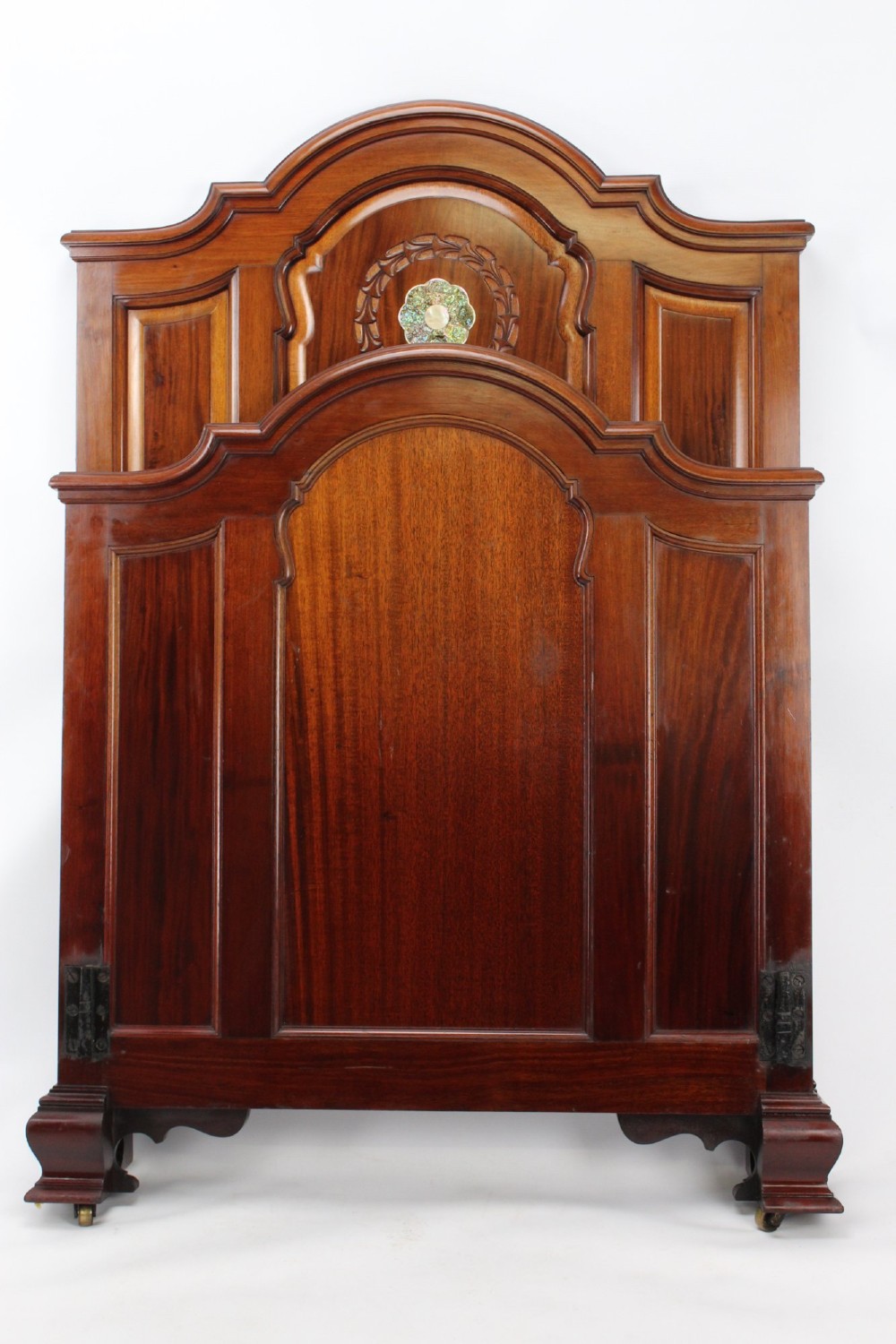 A Victorian walnut single bedstead featuring arched panels, carved circular wreaths, and central mother-of-pearl and abalone shell floral inlays. View II