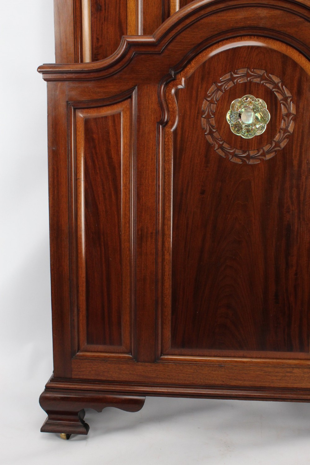 A Victorian walnut single bedstead featuring arched panels, carved circular wreaths, and central mother-of-pearl and abalone shell floral inlays. View VIII