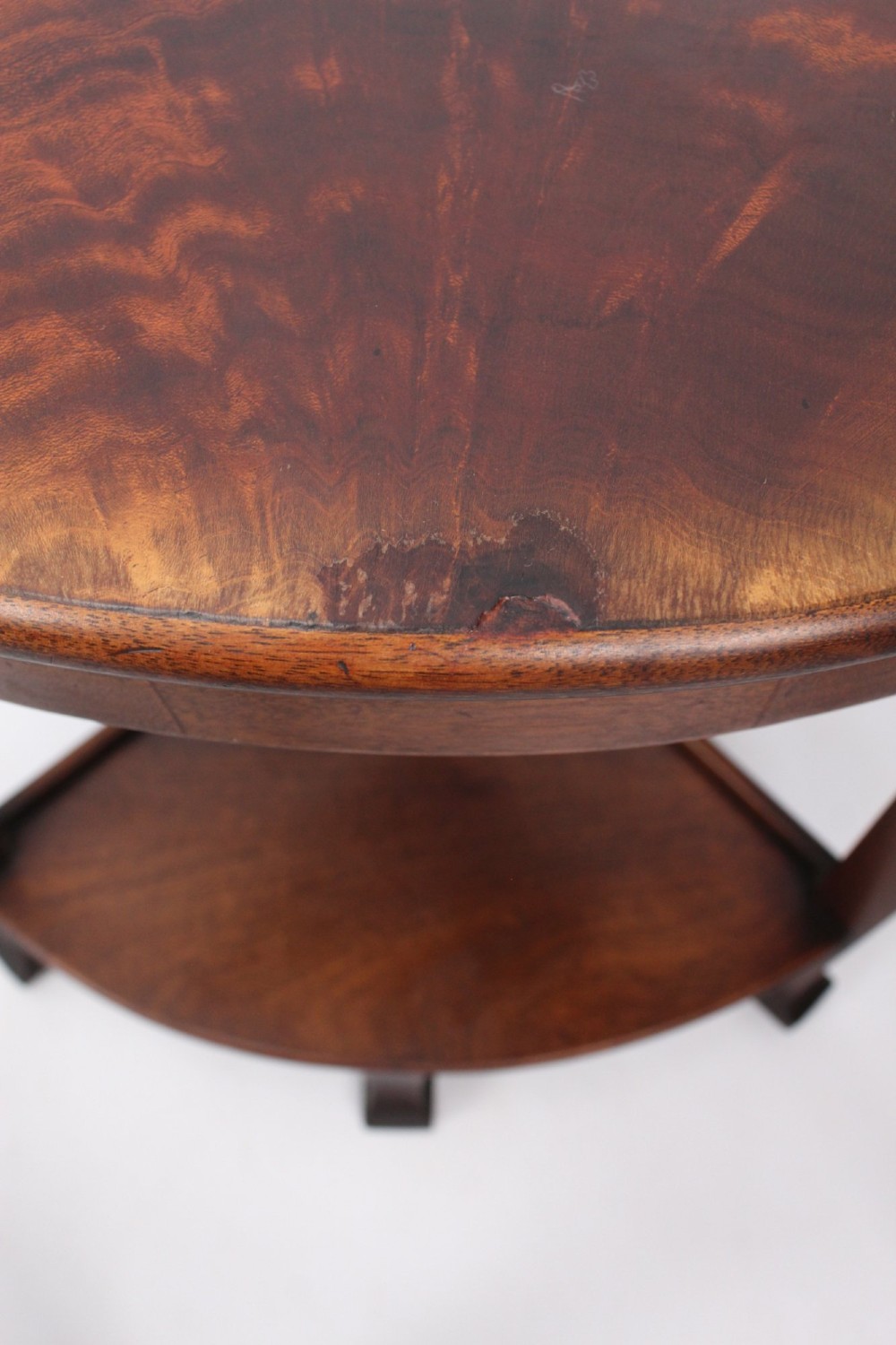 An Art Deco warm brown walnut circular coffee table featuring four sector-shaped nesting side tables stowed underneath. View XI