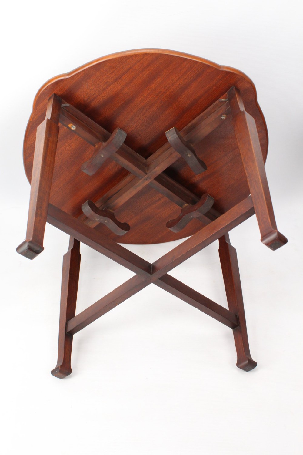An Art Deco warm brown walnut circular coffee table featuring four sector-shaped nesting side tables stowed underneath. View XIII