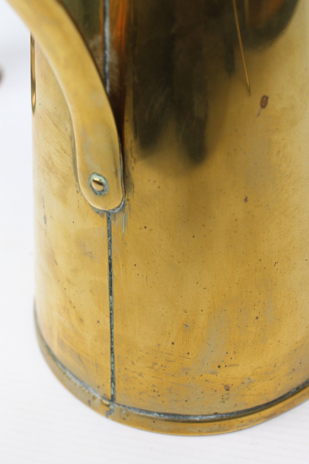 A pair of antique metal jugs, one crafted from repousse copper with brass fittings and a hinged lid alongside a tapered solid brass pitcher. View XIII