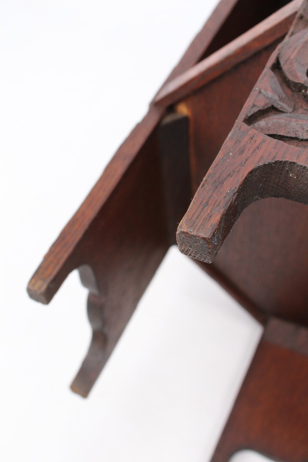 An Edwardian hexagonal dark oak side table featuring intricate relief carving on the top surface and side panels. View XIII