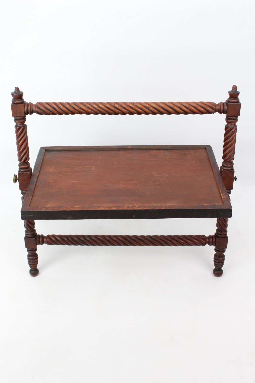 An antique Regency mahogany toilet mirror featuring a swivelling rectangular glass frame supported by rope-twist turned pillars with finials. View V