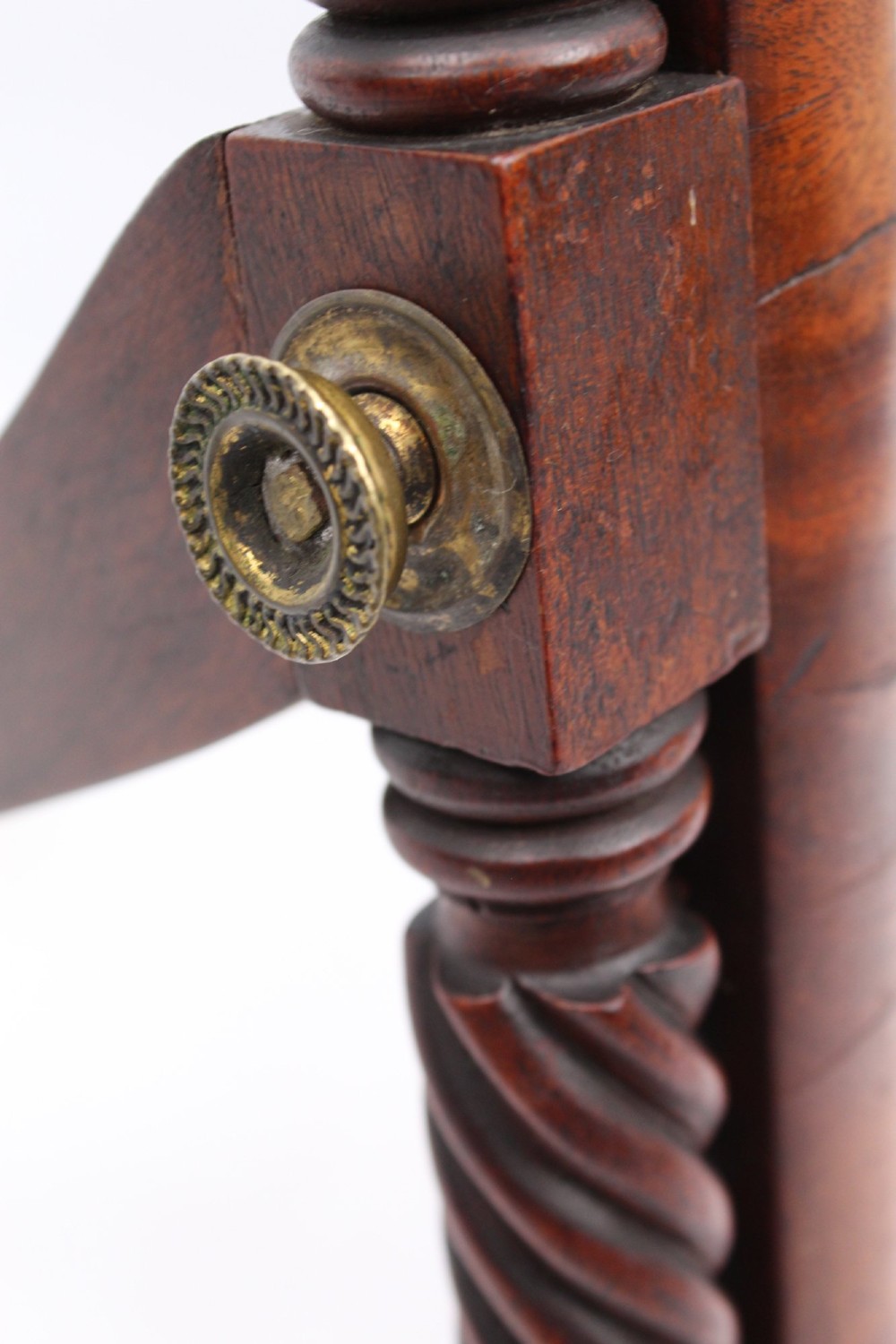 An antique Regency mahogany toilet mirror featuring a swivelling rectangular glass frame supported by rope-twist turned pillars with finials. View XII