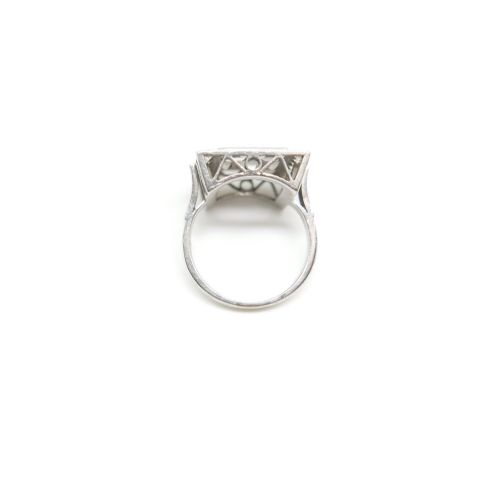 fig 1. A square Art Deco platinum plaque ring set with geometric baguette and round brilliant diamonds with millgrain borders.