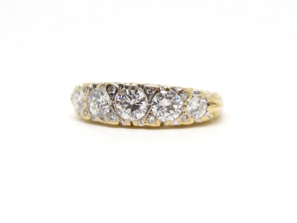 A vintage 18ct yellow gold ring featuring five brilliant-cut diamonds set in a horizontal row across the band. View II